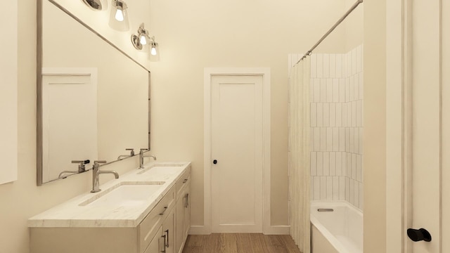 bathroom featuring shower / tub combo, vanity, and wood-type flooring