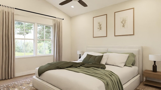 bedroom with lofted ceiling, ceiling fan, and hardwood / wood-style flooring