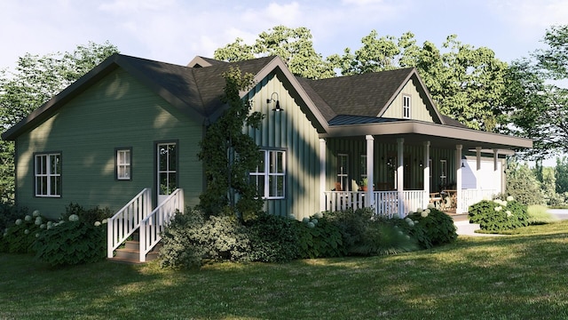 view of side of home featuring a porch and a yard