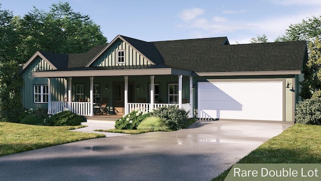 view of front facade with a porch, a garage, and a front lawn