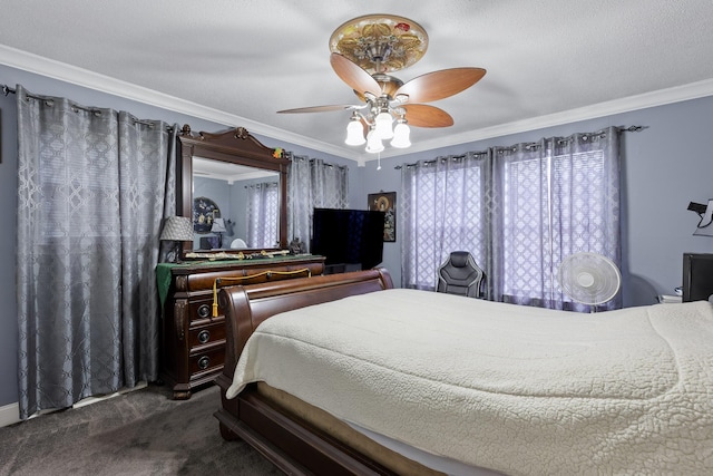 carpeted bedroom with a textured ceiling, ceiling fan, and crown molding