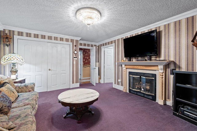 living room with crown molding, carpet floors, a glass covered fireplace, a textured ceiling, and wallpapered walls