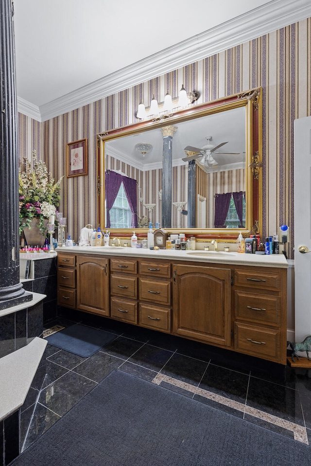 bathroom with crown molding, vanity, and ceiling fan