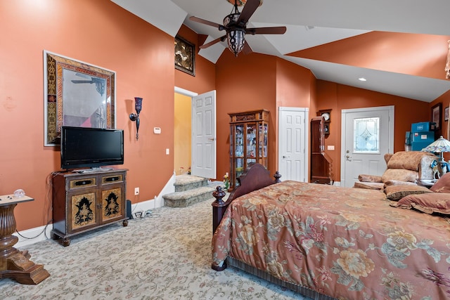 bedroom with carpet flooring, baseboards, vaulted ceiling, and ceiling fan