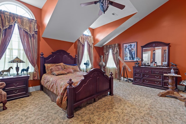 bedroom with high vaulted ceiling, carpet, ceiling fan, and visible vents