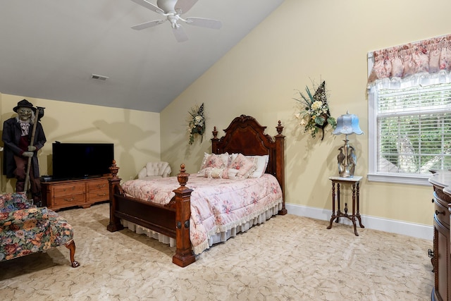 carpeted bedroom with baseboards, visible vents, vaulted ceiling, and a ceiling fan