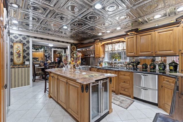 kitchen with stainless steel fridge, beverage cooler, a center island, sink, and dark stone countertops