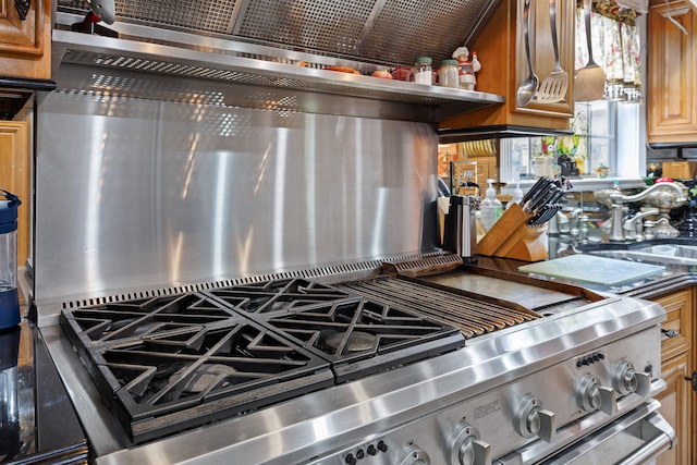 kitchen with high end stove and stainless steel counters