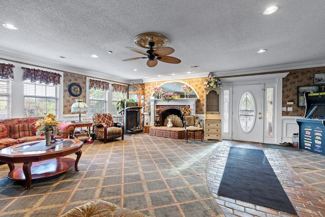 living room with crown molding, a textured ceiling, a brick fireplace, and carpet flooring