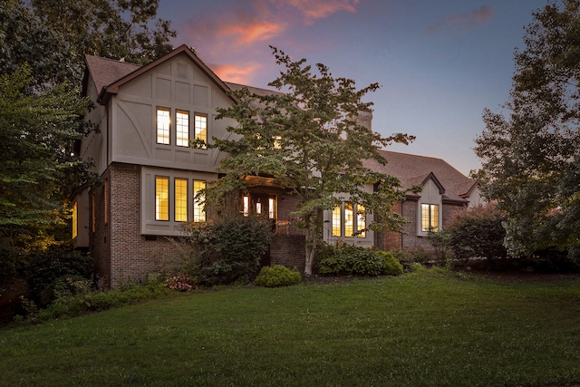 tudor-style house with a lawn