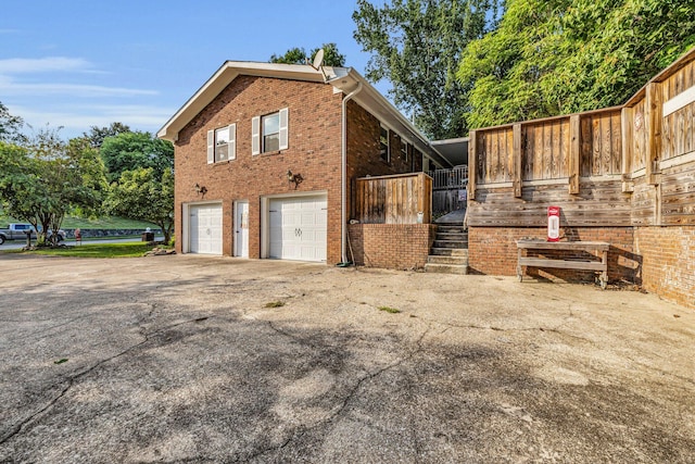 view of side of home featuring a garage