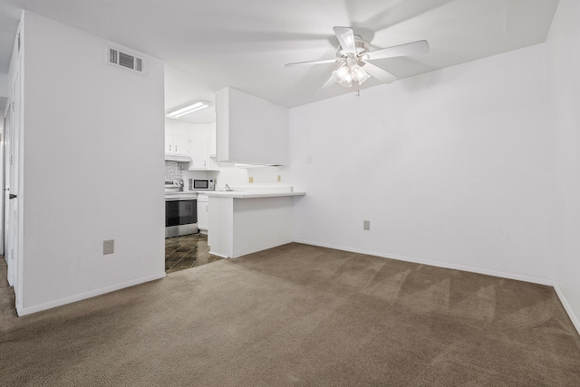 unfurnished living room with dark carpet and ceiling fan