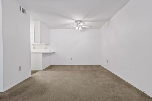 unfurnished living room with carpet flooring and ceiling fan