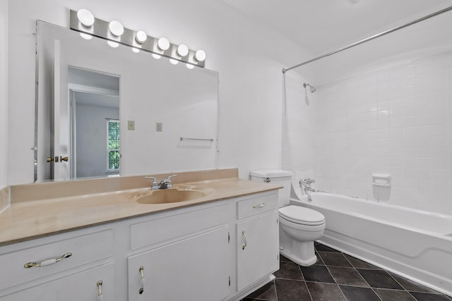 full bathroom featuring vanity, toilet, tile patterned floors, and tiled shower / bath