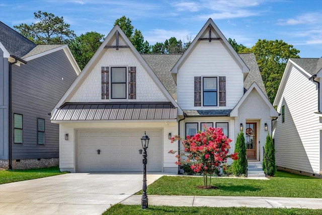 view of front of property featuring a garage