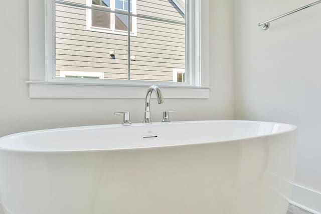 bathroom with a washtub