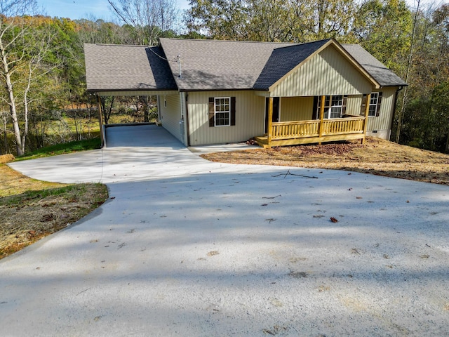 ranch-style house with a porch and a carport