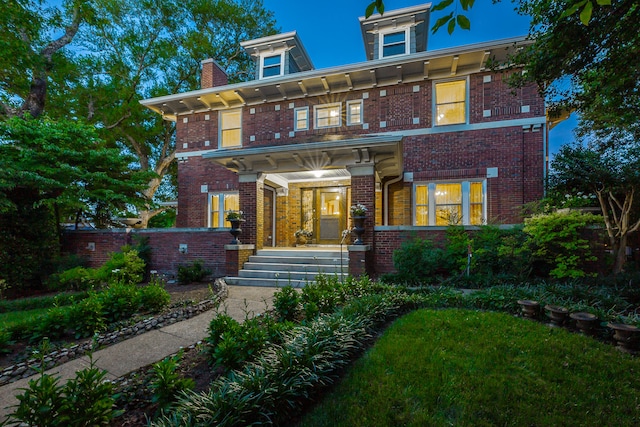 italianate-style house with a front lawn