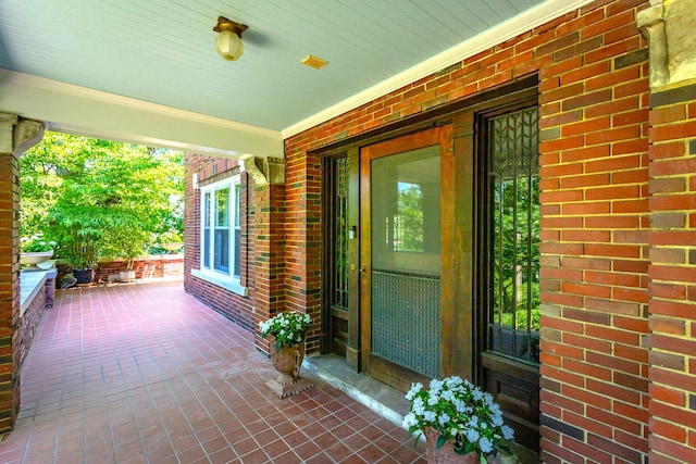 doorway to property featuring covered porch