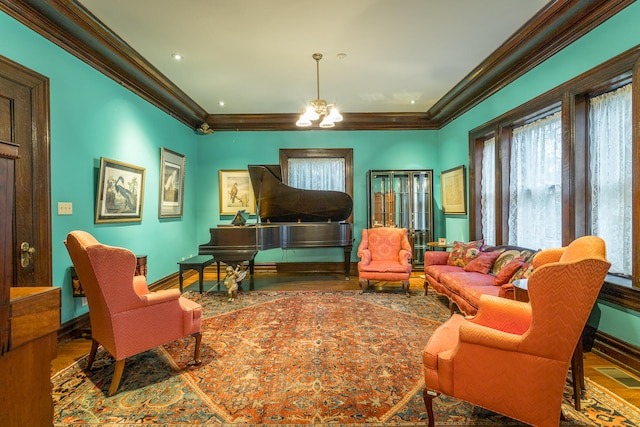 living room featuring hardwood / wood-style floors, a chandelier, and crown molding