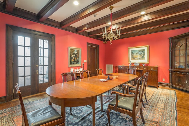 dining area with a notable chandelier, ornamental molding, light hardwood / wood-style flooring, french doors, and beam ceiling