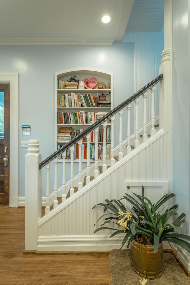 staircase featuring wood-type flooring