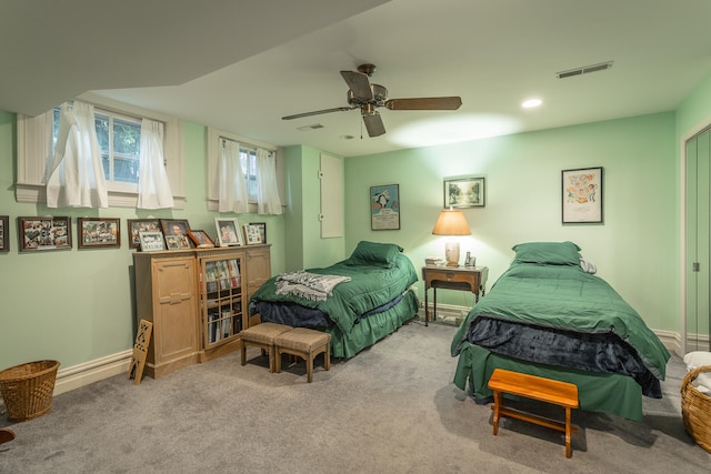 bedroom featuring light carpet and ceiling fan