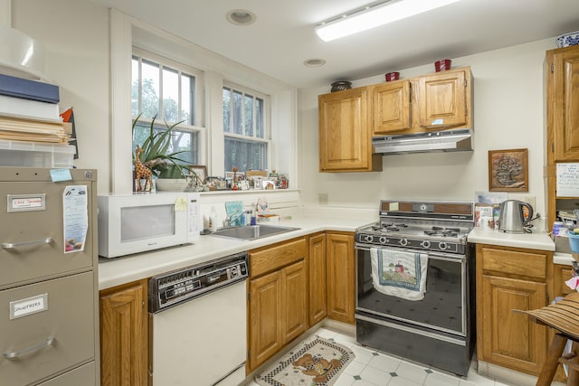 kitchen with white appliances and sink