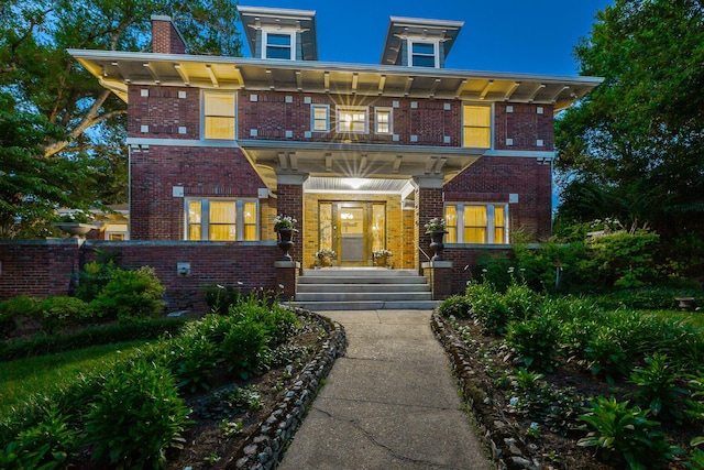 italianate house featuring brick siding