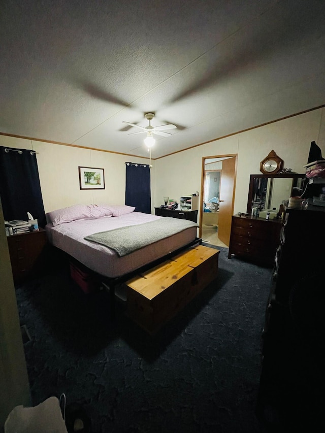 carpeted bedroom featuring ceiling fan and a textured ceiling