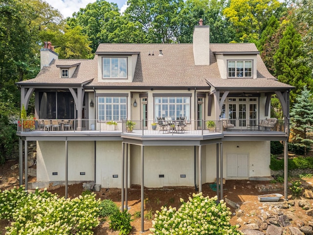 rear view of property with a balcony