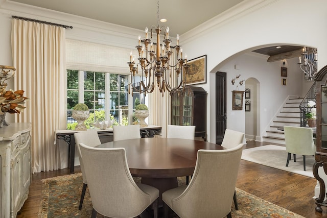 dining space featuring ornamental molding, dark hardwood / wood-style flooring, an inviting chandelier, and beam ceiling