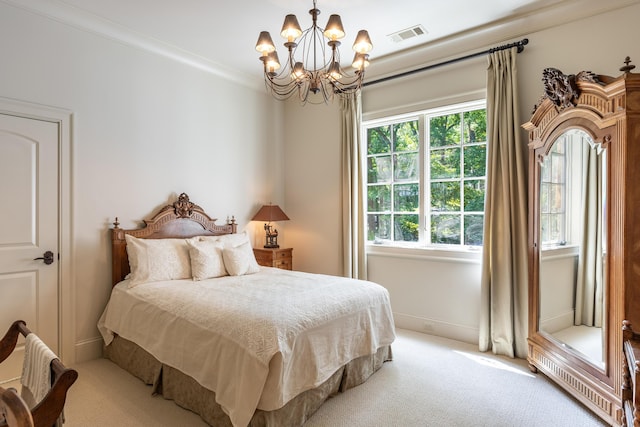 bedroom featuring ornamental molding, light carpet, and an inviting chandelier