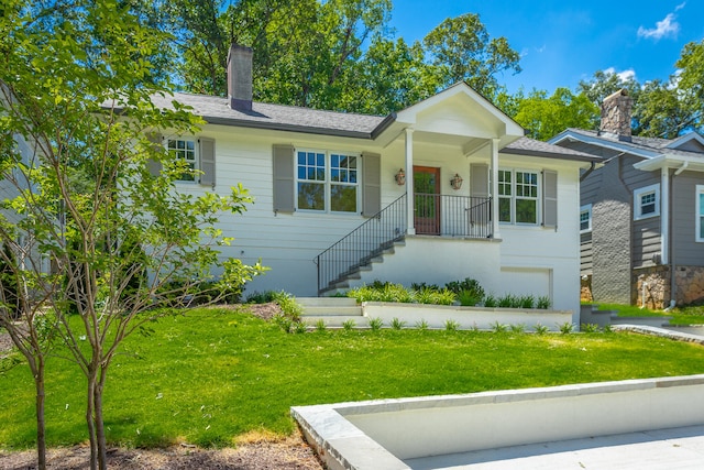 view of front of home with a front yard