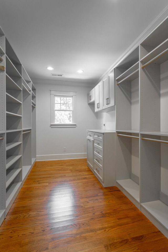 walk in closet featuring hardwood / wood-style flooring