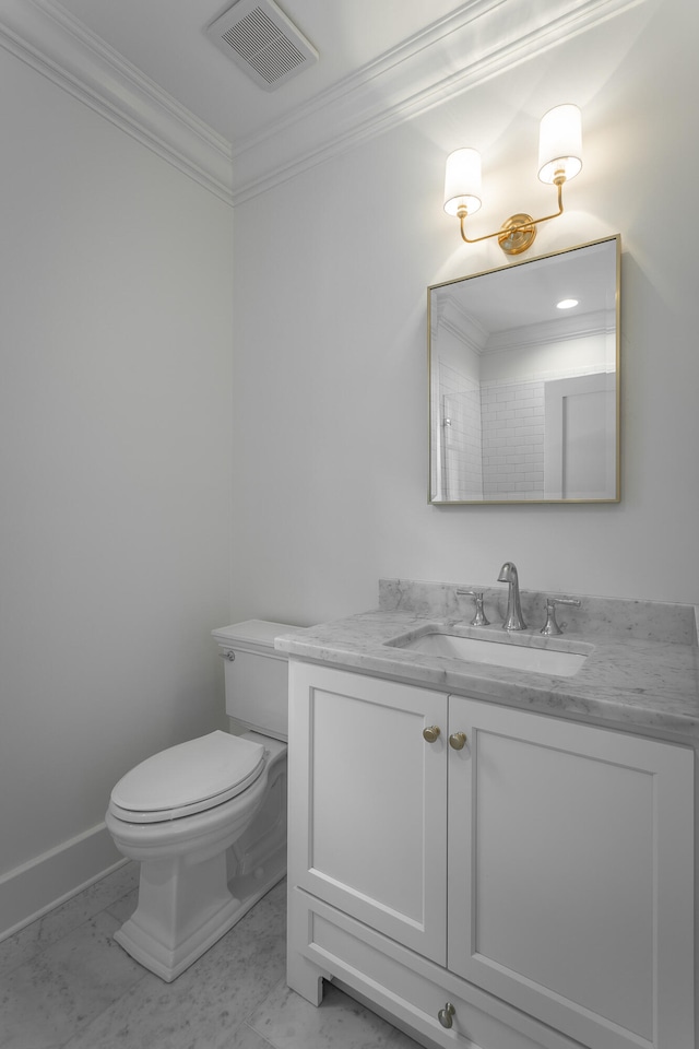 bathroom featuring toilet, crown molding, and vanity