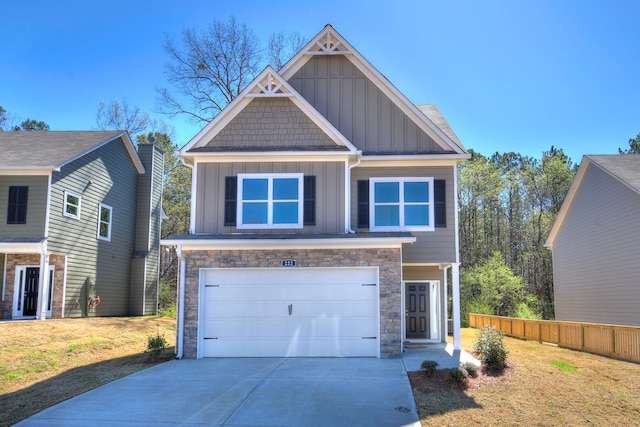 craftsman-style home with a garage and a front lawn