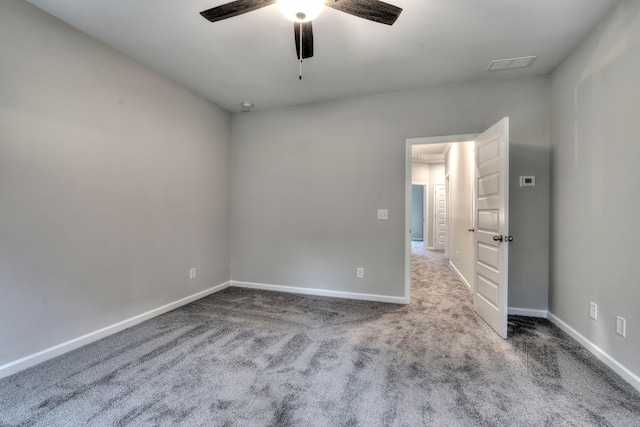 carpeted empty room with ceiling fan