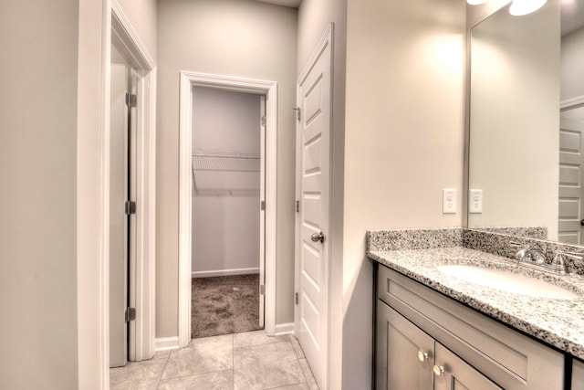 bathroom with vanity and tile patterned flooring