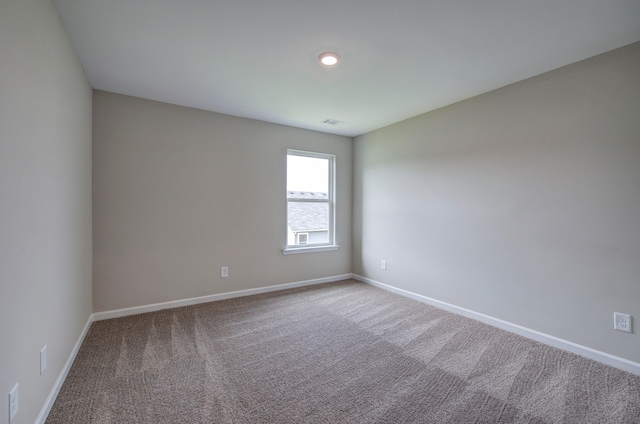 unfurnished room with carpet flooring