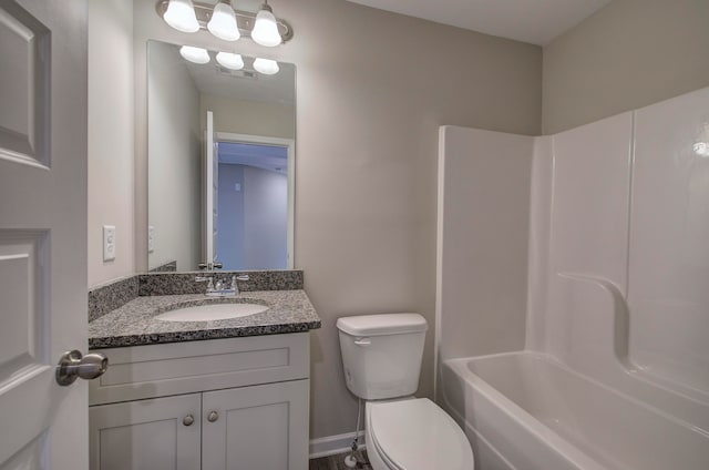 full bathroom featuring vanity, toilet, and  shower combination