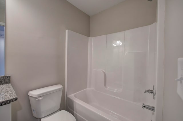 full bathroom with washtub / shower combination, toilet, and vanity