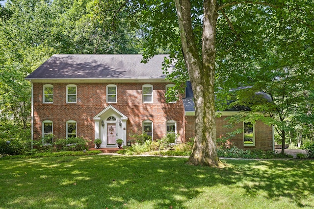 colonial home with a front yard