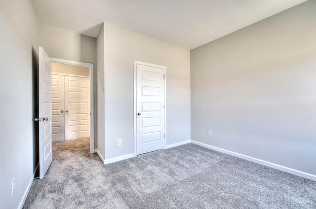 unfurnished bedroom featuring carpet