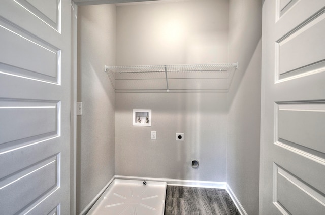 washroom featuring hookup for a washing machine, dark hardwood / wood-style flooring, and electric dryer hookup