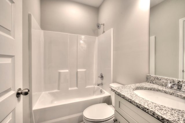 full bathroom featuring vanity, toilet, and  shower combination