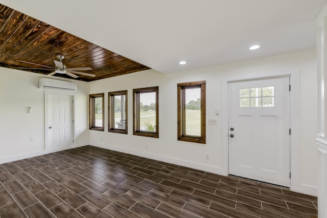 entrance foyer featuring wood ceiling, an AC wall unit, ceiling fan, and dark hardwood / wood-style floors