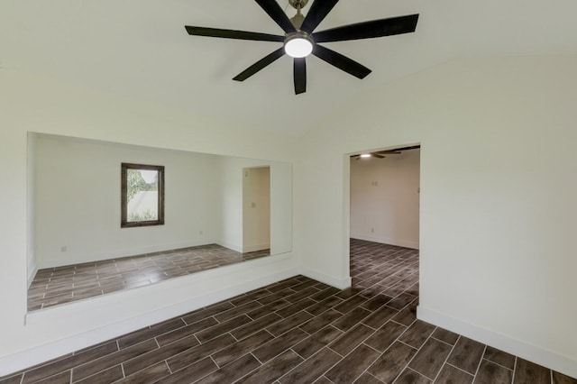 unfurnished room featuring ceiling fan, vaulted ceiling, and dark hardwood / wood-style flooring