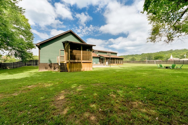 back of house featuring a lawn