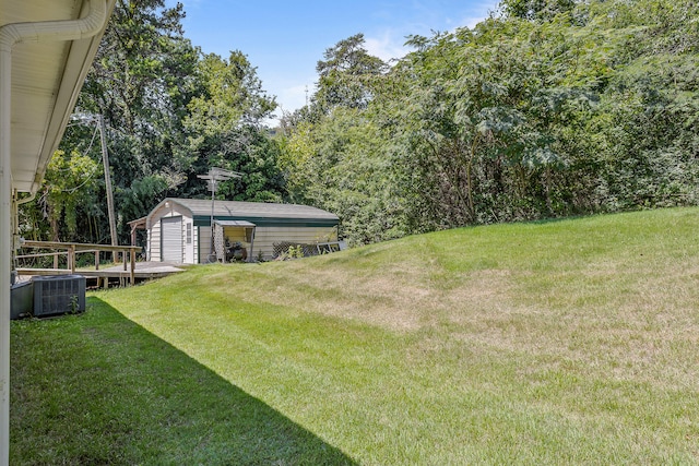 view of yard with a storage unit and central AC